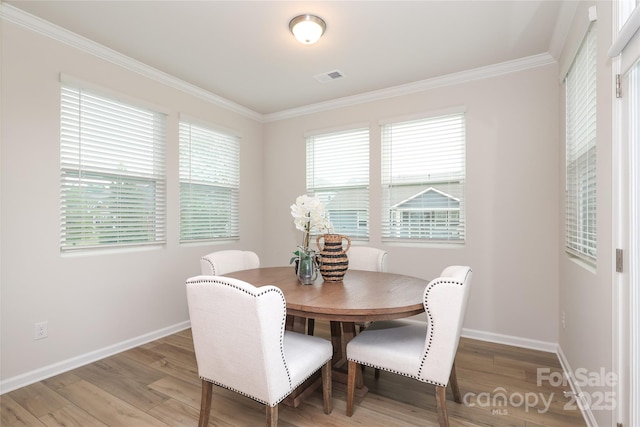 1119 Bellshill Dr, Indian Trail, NC 28079 - dining room featuring crown molding, baseboards, and light wood-type flooring