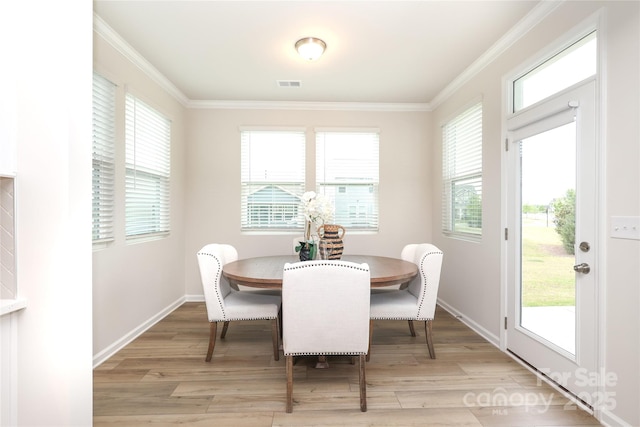 1119 Bellshill Dr, Indian Trail, NC 28079 - dining room with ornamental molding, light wood finished floors, and baseboards