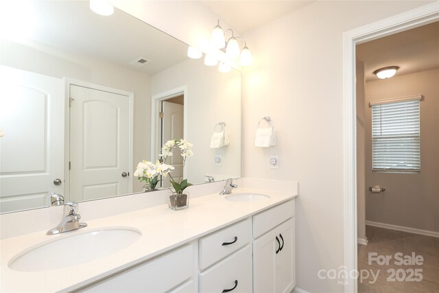 1119 Bellshill Dr, Indian Trail, NC 28079 - full bath featuring double vanity, baseboards, and tile patterned floors