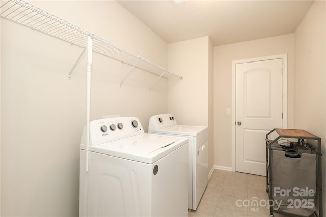 1119 Bellshill Dr, Indian Trail, NC 28079 - washroom with separate washer and dryer, light tile patterned floors, and baseboards