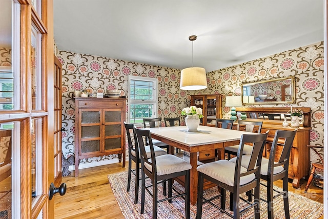 8218 Bright Water Ln, Denver, NC 28037 - dining area with wallpapered walls and light wood finished floors