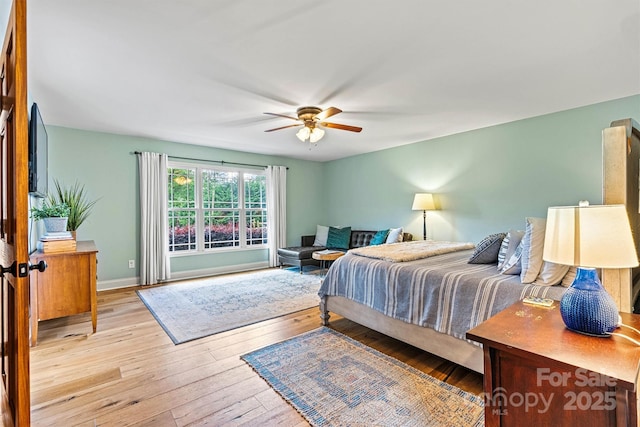 8218 Bright Water Ln, Denver, NC 28037 - bedroom with hardwood / wood-style floors, a ceiling fan, and baseboards