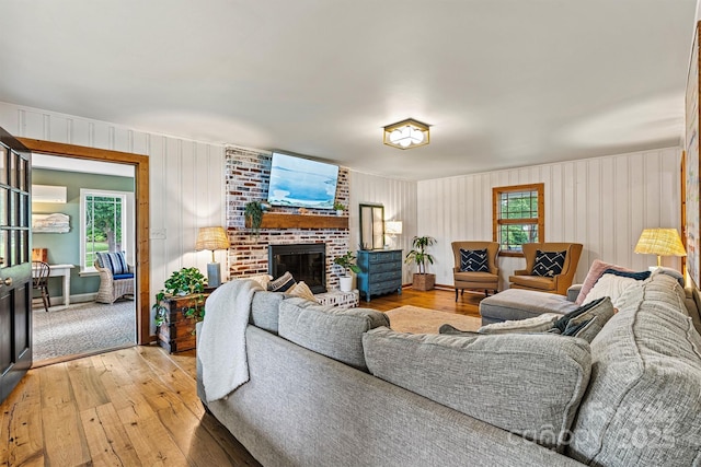 8218 Bright Water Ln, Denver, NC 28037 - living room with light wood-type flooring, plenty of natural light, and a fireplace