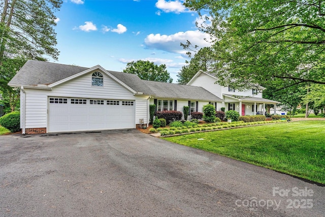 8218 Bright Water Ln, Denver, NC 28037 - traditional home with asphalt driveway, a garage, a front lawn, and roof with shingles