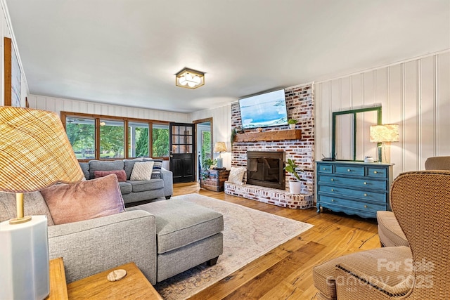 8218 Bright Water Ln, Denver, NC 28037 - living room featuring a brick fireplace and hardwood / wood-style flooring