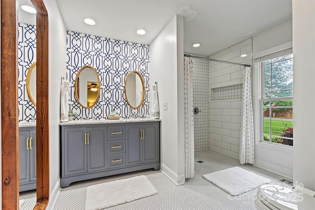8218 Bright Water Ln, Denver, NC 28037 - bathroom featuring a tile shower, double vanity, and recessed lighting