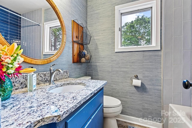8218 Bright Water Ln, Denver, NC 28037 - bathroom with vanity and tile walls