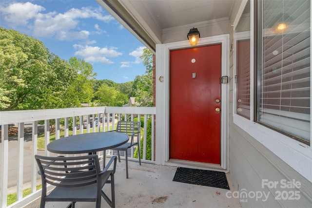 entrance to property featuring a balcony