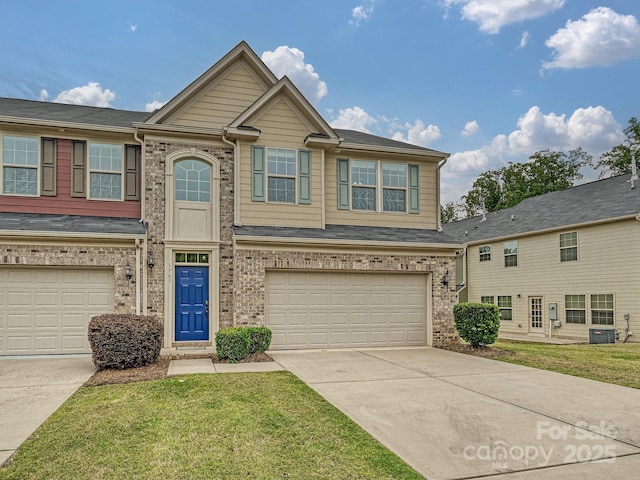 view of front of home featuring a garage, concrete driveway, cooling unit, and brick siding