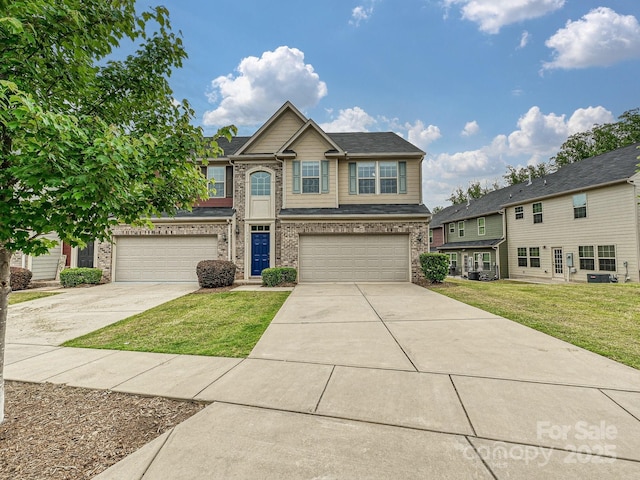 1769 Evergreen Dr, Charlotte, NC 28208 - view of front of house with concrete driveway, a garage, brick siding, and a front lawn