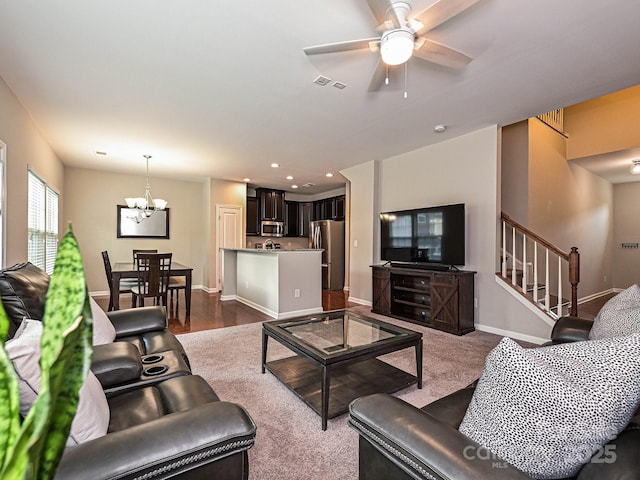 1769 Evergreen Dr, Charlotte, NC 28208 - living room with a chandelier, stairs, a ceiling fan, and recessed lighting