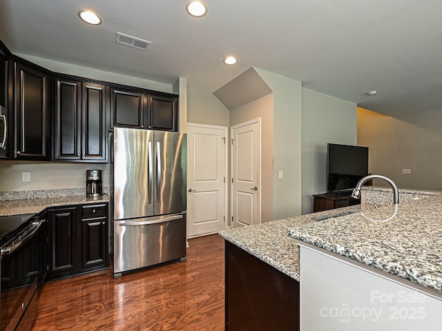 1769 Evergreen Dr, Charlotte, NC 28208 - kitchen with stainless steel appliances, light stone countertops, dark wood-style floors, and recessed lighting