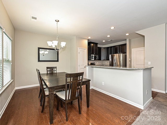 1769 Evergreen Dr, Charlotte, NC 28208 - dining space with a chandelier, recessed lighting, and dark wood-style floors