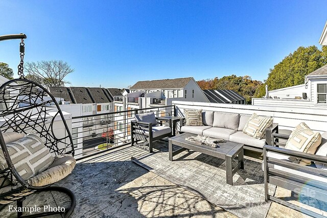 view of patio / terrace with a balcony, an outdoor hangout area, and a residential view