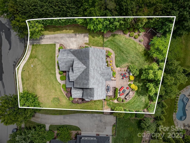 aerial view of property and surrounding area with property parcel outlined