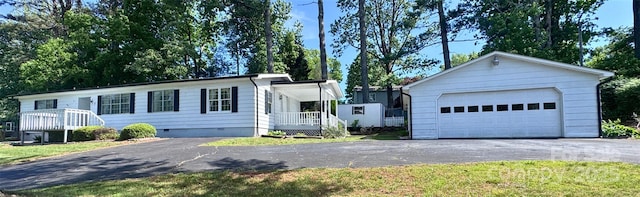 7 Lakewood Rd, Hendersonville, NC 28792 - view of front of property with a detached garage, an outbuilding, and crawl space