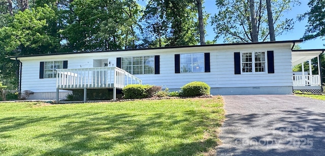 7 Lakewood Rd, Hendersonville, NC 28792 - view of front of property featuring crawl space, a front lawn, driveway, and a wooden deck