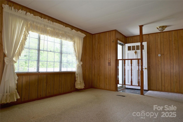 7 Lakewood Rd, Hendersonville, NC 28792 - empty room featuring carpet flooring, wooden walls, and baseboards