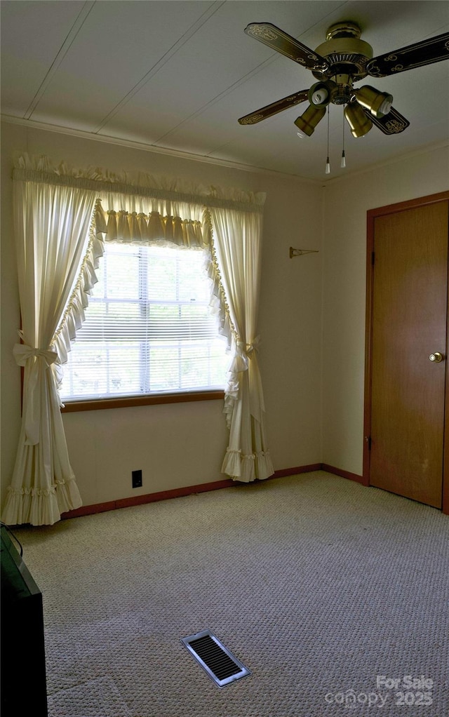 7 Lakewood Rd, Hendersonville, NC 28792 - empty room featuring light carpet, a ceiling fan, baseboards, and crown molding
