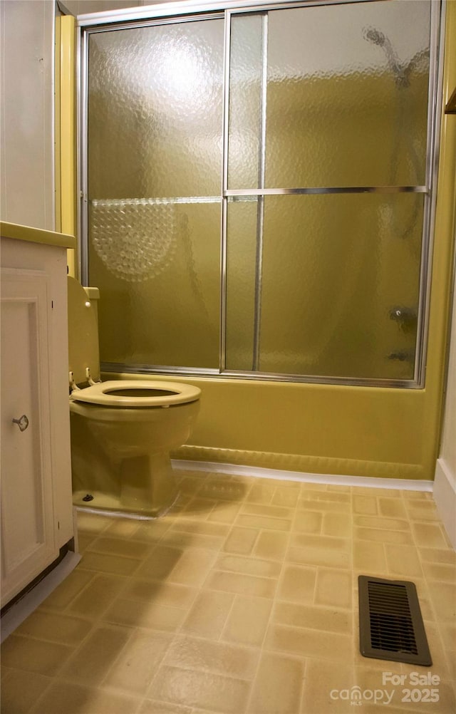 7 Lakewood Rd, Hendersonville, NC 28792 - bathroom featuring shower / bath combination with glass door and toilet