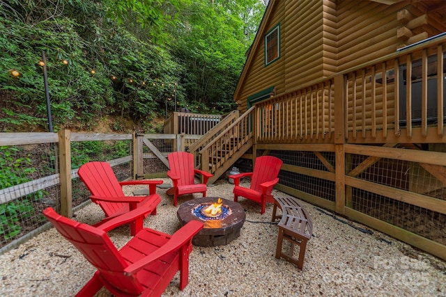 45 Ginger Ln, Waynesville, NC 28785 - deck featuring a fire pit, stairway, and fence