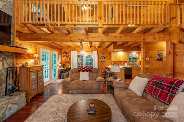 45 Ginger Ln, Waynesville, NC 28785 - living room with wood walls, dark wood-style flooring, beam ceiling, and french doors