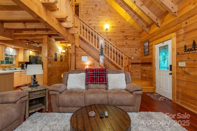45 Ginger Ln, Waynesville, NC 28785 - living area with dark wood-style flooring, stairway, wooden walls, wood ceiling, and plenty of natural light
