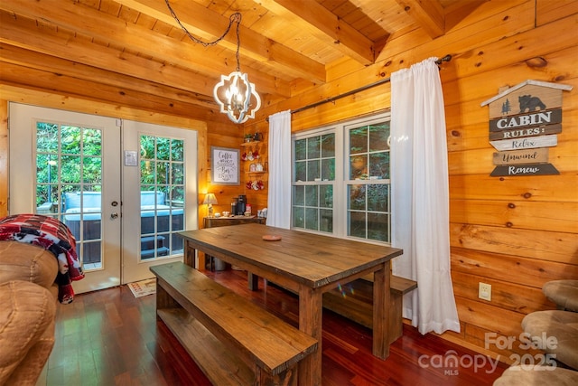 45 Ginger Ln, Waynesville, NC 28785 - dining area with wooden ceiling, dark wood finished floors, beamed ceiling, wood walls, and a chandelier