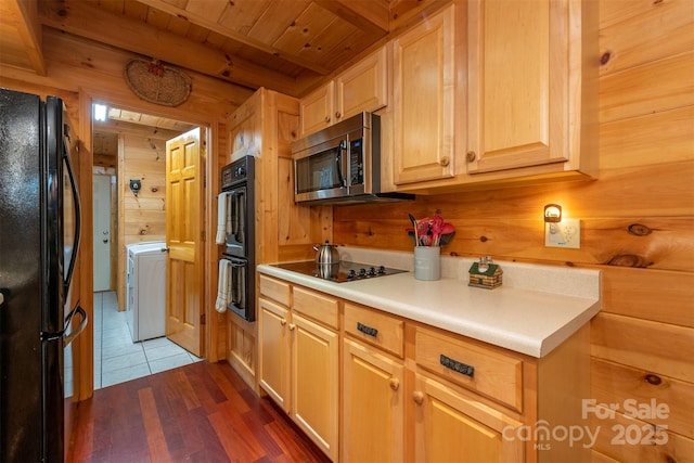 45 Ginger Ln, Waynesville, NC 28785 - kitchen featuring black appliances, washer / dryer, beamed ceiling, wooden walls, and wooden ceiling