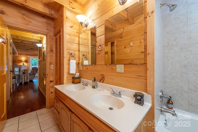 45 Ginger Ln, Waynesville, NC 28785 - ensuite bathroom featuring wood walls, tile patterned floors, double vanity, bathing tub / shower combination, and wooden ceiling