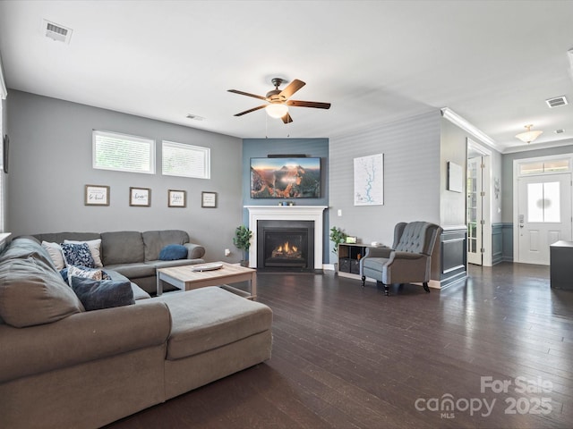 1305 Kings Grove Dr, York, SC 29745 - living area with a ceiling fan, a fireplace with flush hearth, dark wood finished floors, and crown molding