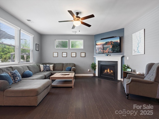 1305 Kings Grove Dr, York, SC 29745 - living room featuring a ceiling fan, a glass covered fireplace, wood finished floors, and baseboards