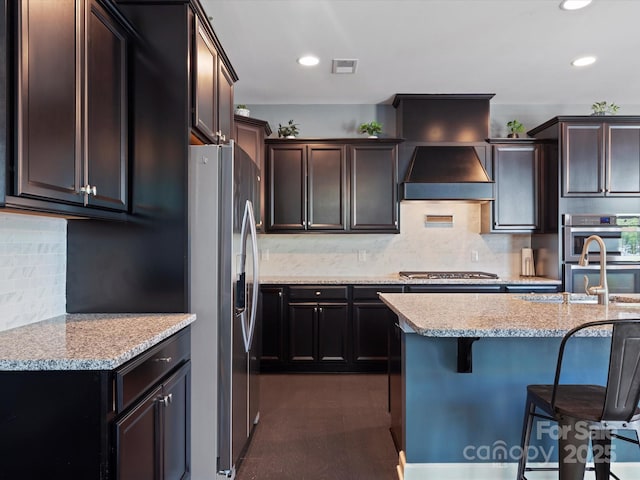 1305 Kings Grove Dr, York, SC 29745 - kitchen with stainless steel appliances, a kitchen breakfast bar, light stone countertops, tasteful backsplash, and recessed lighting