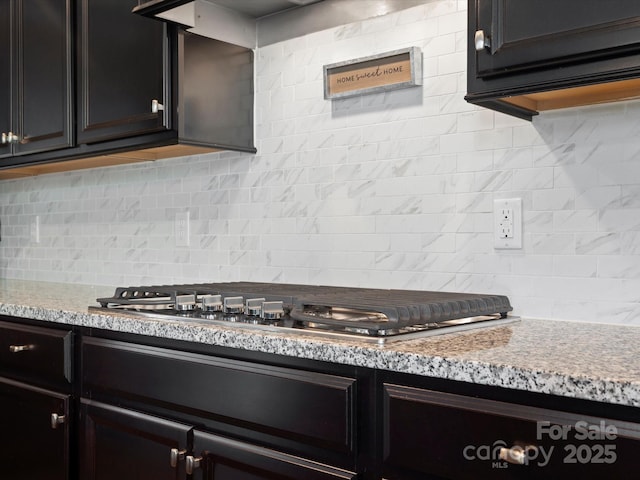1305 Kings Grove Dr, York, SC 29745 - kitchen with tasteful backsplash, stainless steel gas cooktop, and light stone countertops