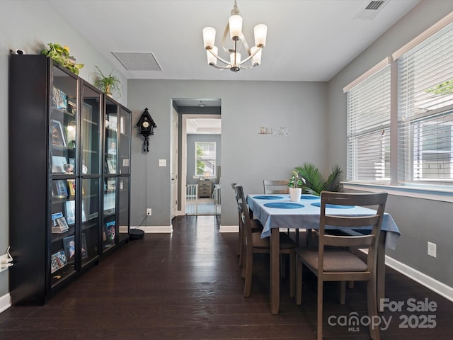 1305 Kings Grove Dr, York, SC 29745 - dining room with a chandelier, wood finished floors, and baseboards