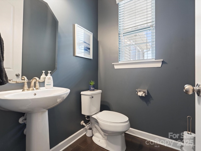 1305 Kings Grove Dr, York, SC 29745 - bathroom with baseboards, toilet, and wood finished floors