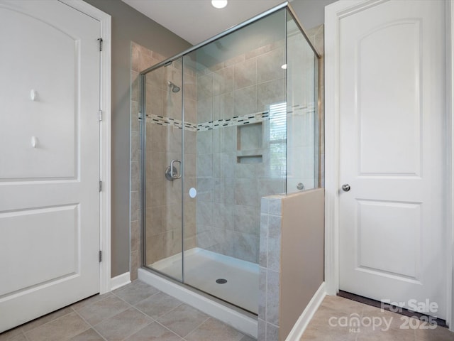 1305 Kings Grove Dr, York, SC 29745 - bathroom with a stall shower, baseboards, and tile patterned floors