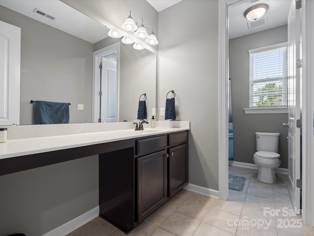 1305 Kings Grove Dr, York, SC 29745 - bathroom featuring vanity, toilet, tile patterned flooring, and baseboards