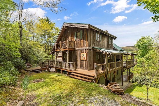 6338 W View Dr, Newland, NC 28657 - back of property with a lawn, a wooden deck, and a chimney