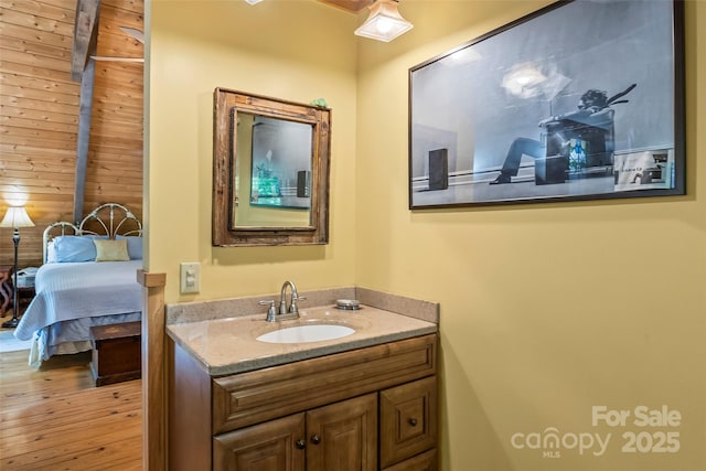 6338 W View Dr, Newland, NC 28657 - bathroom with vanity, wood walls, and wood finished floors
