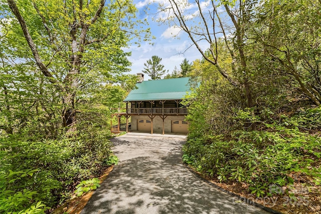 6338 W View Dr, Newland, NC 28657 - view of home's community with asphalt driveway and an attached garage