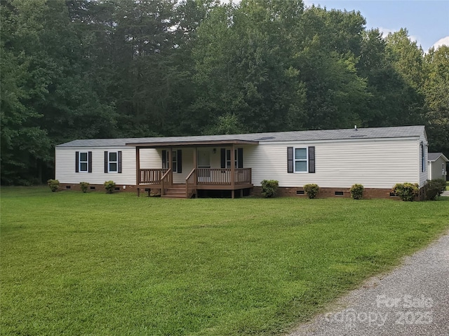 manufactured / mobile home featuring crawl space, a porch, and a front yard