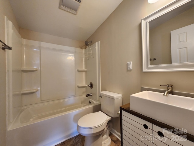 full bathroom featuring toilet, vanity, baseboards, vaulted ceiling, and shower / bathtub combination