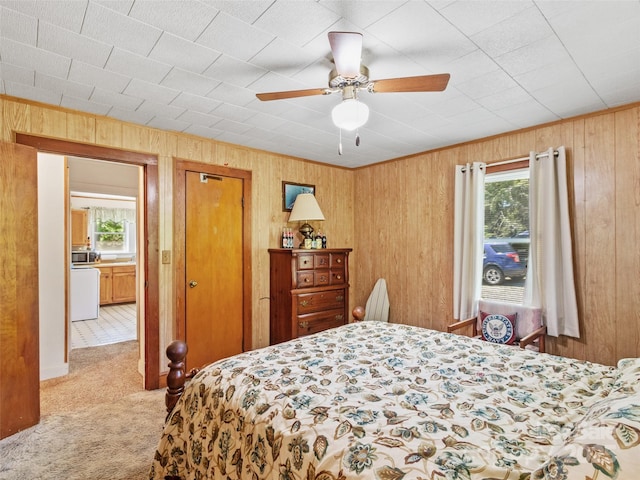 43 Charter Way, Burnsville, NC 28714 - carpeted bedroom with wooden walls, a closet, and a ceiling fan