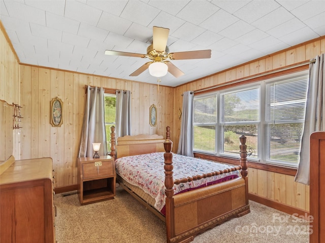 43 Charter Way, Burnsville, NC 28714 - bedroom with wood walls, baseboards, a ceiling fan, and light carpet