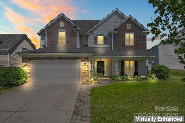 view of front of home featuring a porch, a lawn, driveway, and a garage