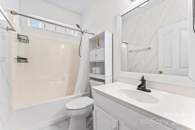 bathroom with marble finish floors, shower / bathtub combination with curtain, vanity, and toilet