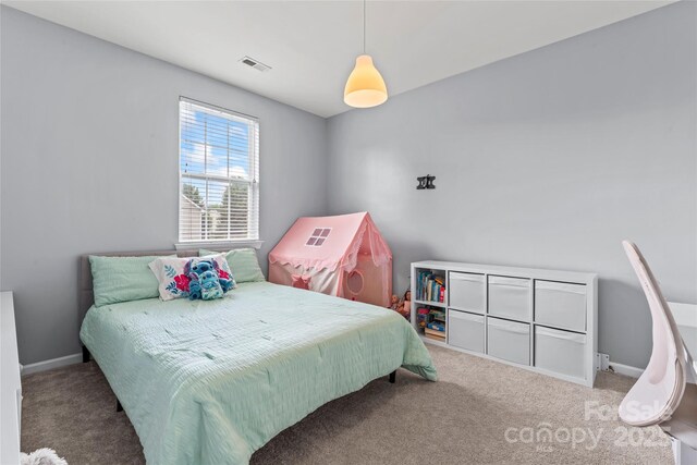 bedroom with carpet and baseboards