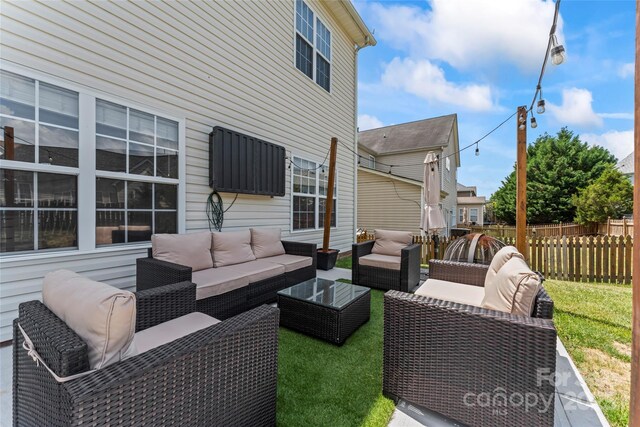 view of patio / terrace featuring fence and an outdoor living space