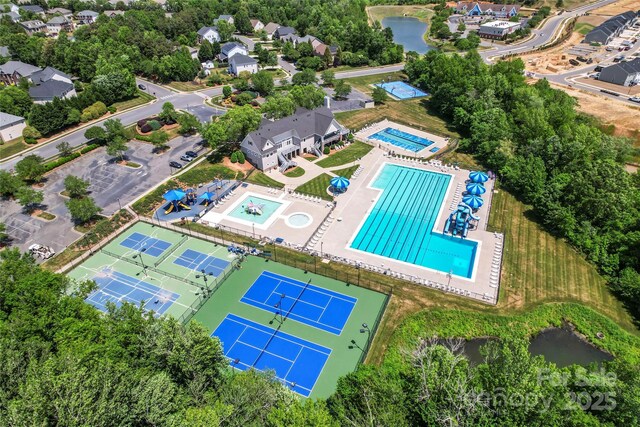 bird's eye view of a pool and a large body of water